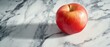 © Ai Studio - A vividly red apple sits on a marbled table, basking in natural light, casting defined shadows on the sleek surface.