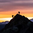 © Riya - Silhouette of hikers on a mountain peak at sunset