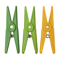 spring season equipment, three colorful clothespins in green and yellow isolated on a white backgrou