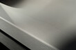 © Henk Vrieselaar - Background of stretched finely perforated steel with geometric shapes. Narrow depth of field, selective focus