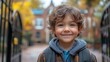 © Tatiana Vagizova - Happy Child Smiling Outside the School Gate on a Bright Morning. Generative AI