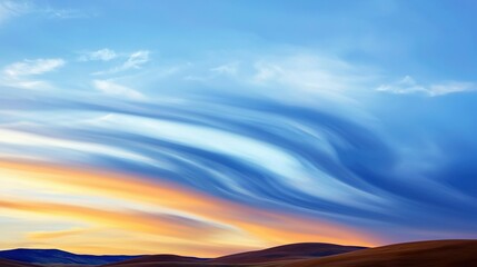 Wall Mural - a vibrant blue and orange sky with fluffy clouds and lush green hills in the foreground, contrasted 