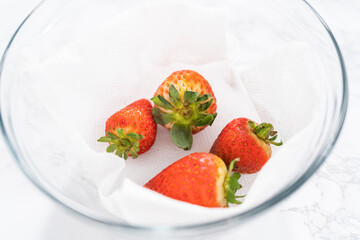 Wall Mural - Washed and Dried Strawberries Neatly Stored in a Glass Bowl