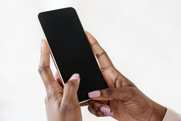 Fototapete - Modern Smartphone With Black Blank Screen In Hands Of Unrecognizable Black Lady, Mockup Image