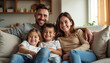 © AlenaSi - Happy family posing together on a cozy sofa at home