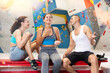 © JackF - Joyful male and female climbers chatting joyfully sitting on bench in indoor climbing area
