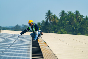 Wall Mural - two engineers install solar panels on a rooftop, wearing safety gear and helmets. the scene showcase