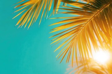 Wall Mural - Vibrant Tropical Palm Leaves against Clear Blue Sky with Radiant Sunlight