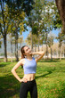 © Prathankarnpap - Young woman in sportswear resting after workout in a beautiful park