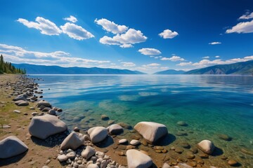 Wall Mural - there is a large body of water with rocks on the shore