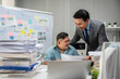 © Kawee - Asian young businessman patient work with manager in office workplace.