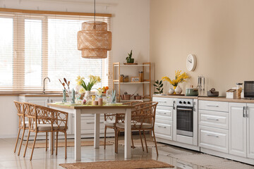 Canvas Print - Interior of modern kitchen room with festive Easter table setting