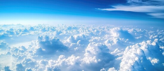 Poster - Vast blue sky with fluffy white clouds scattered throughout, capturing a serene atmosphere and tranquil beauty in a high-altitude landscape.