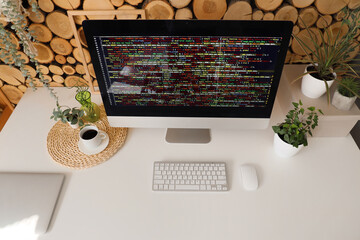 Wall Mural - stylish workplace of programmer with modern computer near wooden wall in light office
