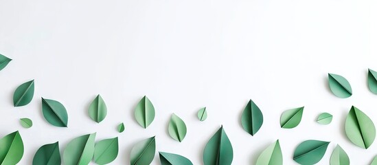 Leinwandbilder - Handmade green origami leaves arranged artistically on a clean white background creating a soothing and elegant paper craft design.