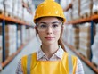 © photobuay - Warehouse safety protocols female worker in hard hat industrial setting professional portrait focused view