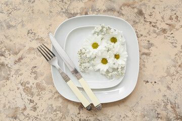 Wall Mural - Beautiful table setting with plates, cutlery and flowers on grunge background