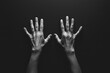 © PerfectPix - Hands Reaching Upward Against a Dark Background in High Contrast Black and White Photography