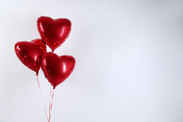 Sticker - Heart-shaped red balloons on light background, space for text. Valentine's day