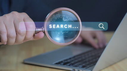 Wall Mural - marketing searching business and web browser data trend concept.businessman hold magnifier glass and