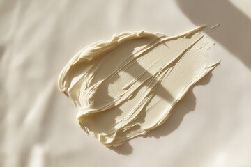 Poster - Creamy white substance spread over a smooth surface with natural light casting soft shadows