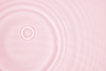Wall Mural - abstract transparent water shadow surface texture natural ripple on pink background