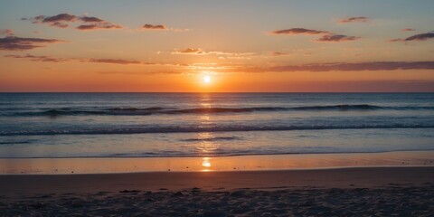 Wall Mural - tranquil sunset over sandy beach with calm waves and space for text ideal for holiday or travel them
