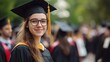 © Elchin Abilov - Young female graduate standing with fellow university graduates in the background