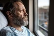 © Kliapko_Photo - A guy in a hospital bed looking out the window, thinking .
