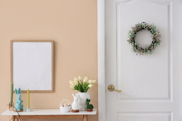 Wall Mural - Interior of hallway with blank frame, table and Easter wreath on door