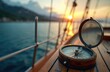 © Viktor - Vintage compass on wooden sailboat deck at sunset. Nautical navigation tool, sea exploration equipment. Marine travel adventure, yachting journey. Traditional seafaring vessel orientation, golden