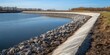 © rookielion - River overflow prevention showcasing levee reinforcement and waterway maintenance efforts : infrastructure protection theme