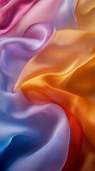 Poster - Colorful flowing silk fabric in shades of pink, purple, and orange creating a smooth texture. Elegant design and luxury material concept