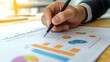 © arsya - Financial Analyst Reviewing Business Charts and Graphs