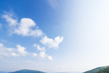 Wall Mural - white cumulus clouds on a blue sky. wonderful nature background of atmosphere condition in day light