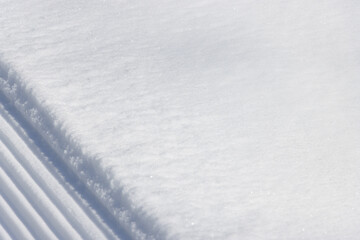 Wall Mural - diagonal lines and flat surface of bright white snow