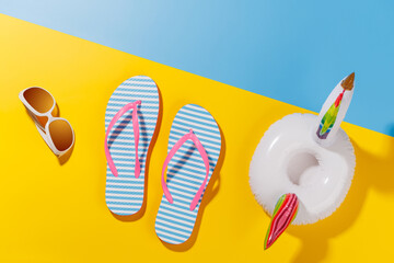 Poster - A vibrant summer vacation scene with flip flops, shades, and a floating flamingo