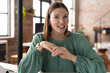 © Wavebreak Media - Smiling woman in green blouse discussing ideas in modern office space