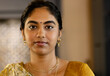 © Wavebreak Media - Confident Indian woman in traditional attire looking at camera at home