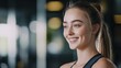 © SHI - Smiling young woman in activewear exudes confidence and vitality.