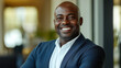 © Lizbond - Professional smiling man in a business setting, showcasing confidence and warmth