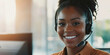 © Purple_Lamp - Smiling Customer Service Representative Wearing Headset in Bright Office