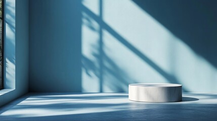Fototapete - Bright sunlight streams through large windows, illuminating a minimalistic room with soft blue walls. A round white pedestal sits centered, casting delicate shadows on the floor