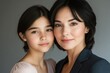 © stockphoto02 - A close-up portrait of a mother and daughter, showcasing their similar features and bond.