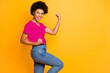 © deagreez - Copyspace photo of trendy rejoicing ecstatic overjoyed black girlfriend wearing t-shirt jeans denim screaming with victory while isolated over yellow vivid color background