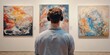 © Alien - Minimal back view of man wearing headphones looking at abstract paintings visiting modern art gallery