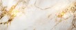 © Natty - Elegant marble featuring striking gold highlights on a white background.