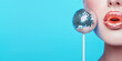 © SnowElf - Female mouth with bright lips and disco ball lollipop on a stick, creative party concept, nightclub, disco advertisement