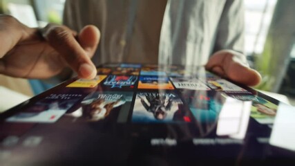 europe- march 17 2022: close-up footage of male fingers touching screen of digital tablet. unrecogni