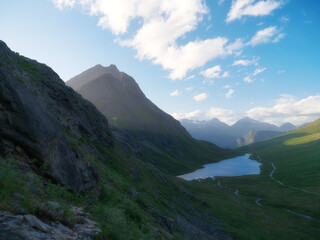 Wall Mural - nature in norway. panoramic view of wild norway. lake among the rocks and mountains. bright sunshine